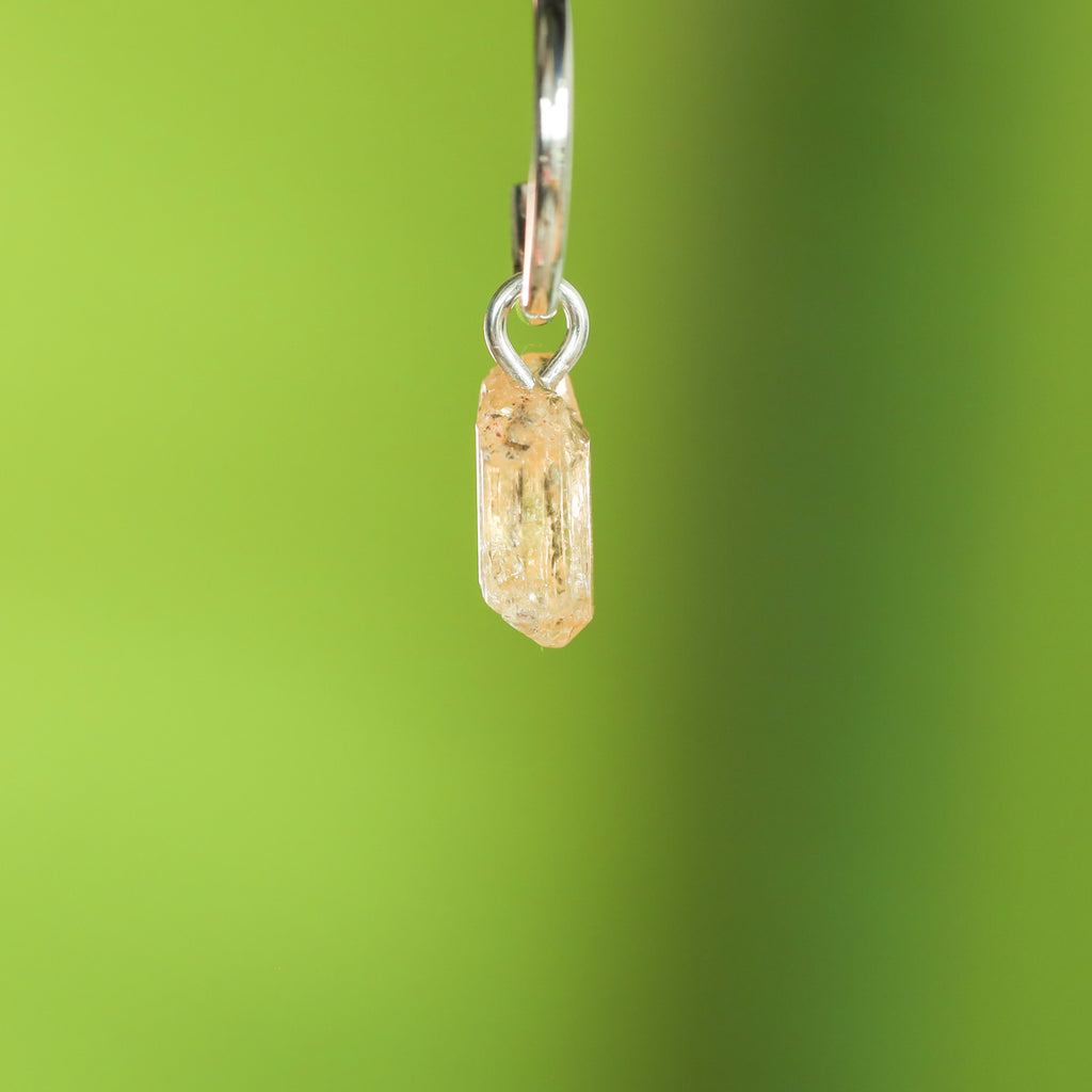 Goudtopaas oorringbedel