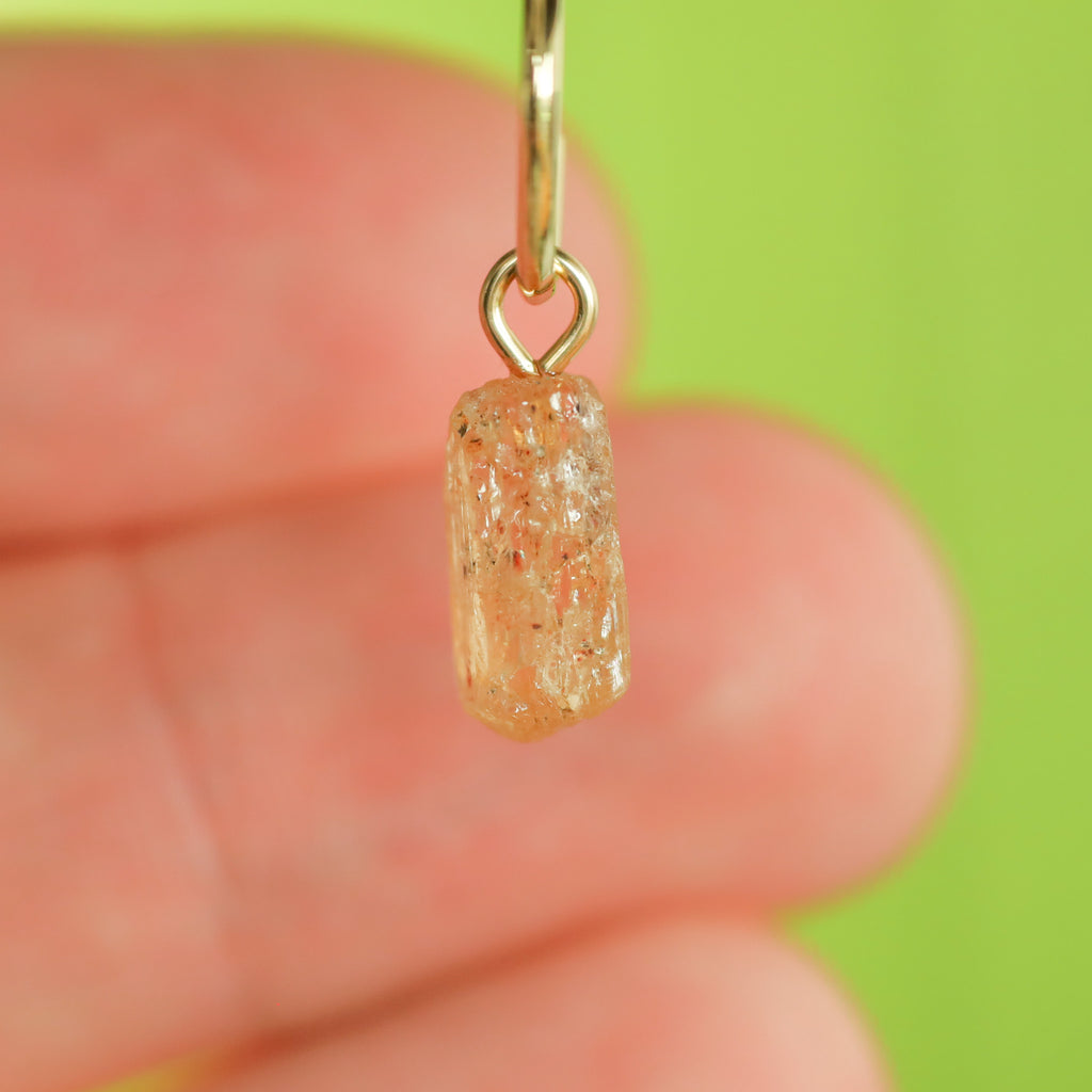 Goudtopaas oorringbedel