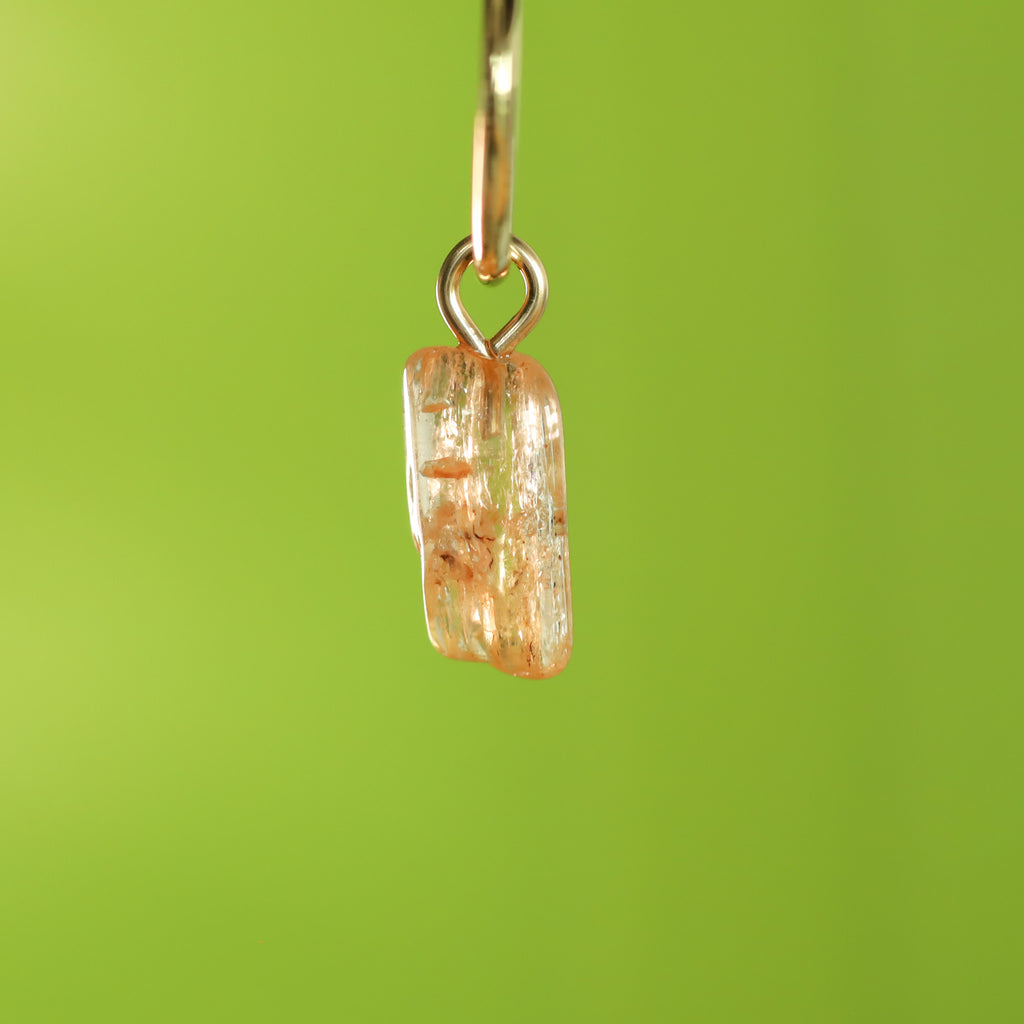 Goudtopaas oorringbedel